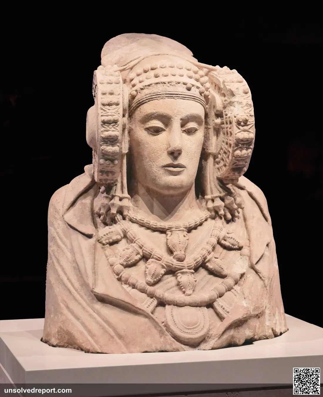 Close-up of the Lady of Elche bust showing the ornate headdress with disc-shaped coils (rodetes), National Archaeological Museum, Madrid.