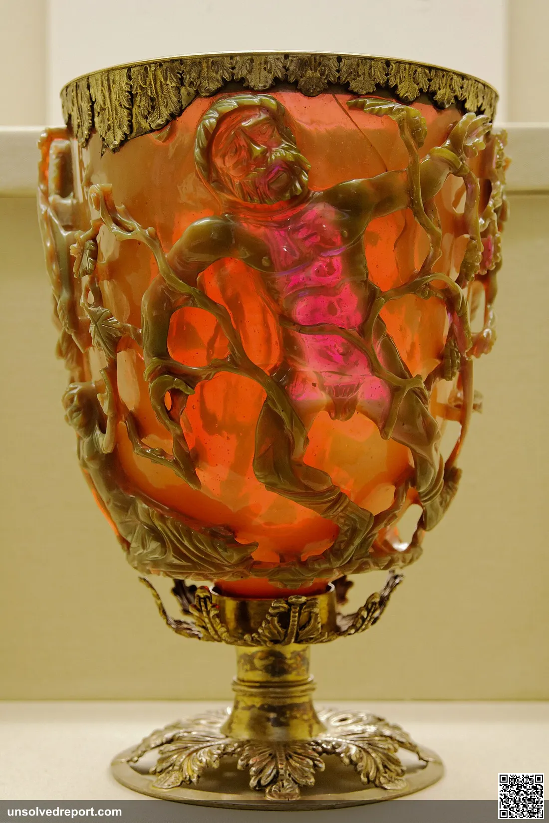 The madness of King Lycurgus; side A of a Late Roman cage cup in dichroic (changing colour) glass, here glowing glowing…