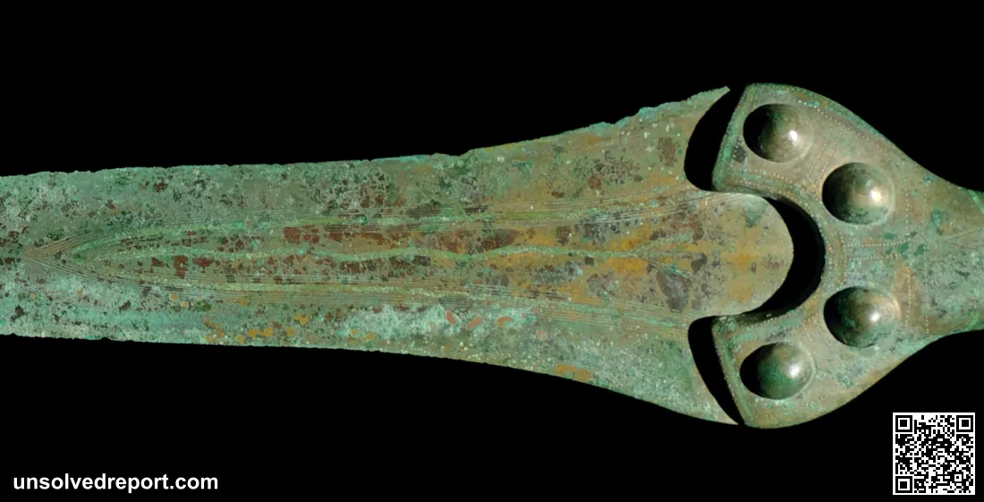 Detail of one of the swords buried with the Nebra Sky Disc, showing the 'serpent' depicted on the central rib of the bl…