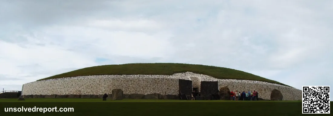 Newgrange passage tomb County Meath Boyne Valley Ireland white quartz facade entrance with visitors