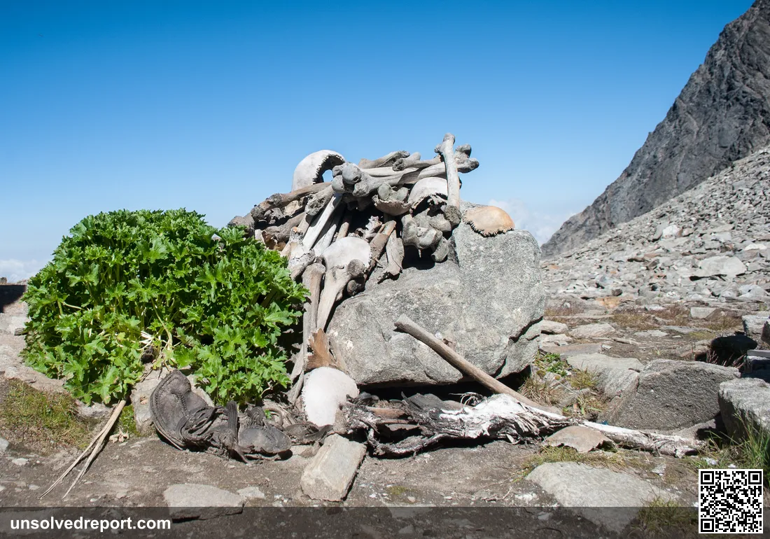 Human skeletal remains piled on the rocks at Roopkund Lake in the Indian Himalayas