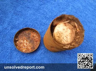 Saddle Ridge Hoard small rusted can on blue background